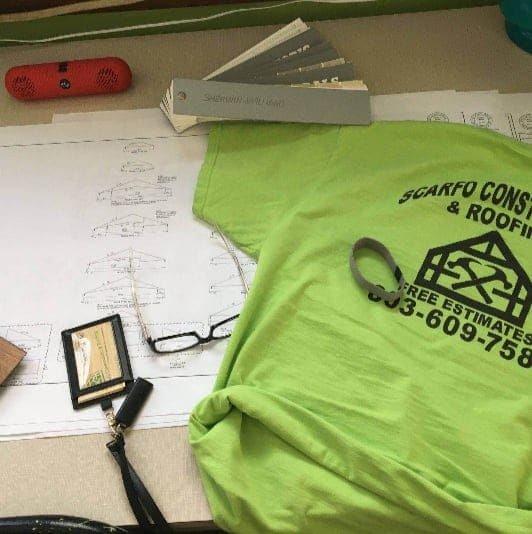 Blueprints, glasses, and office desk materials